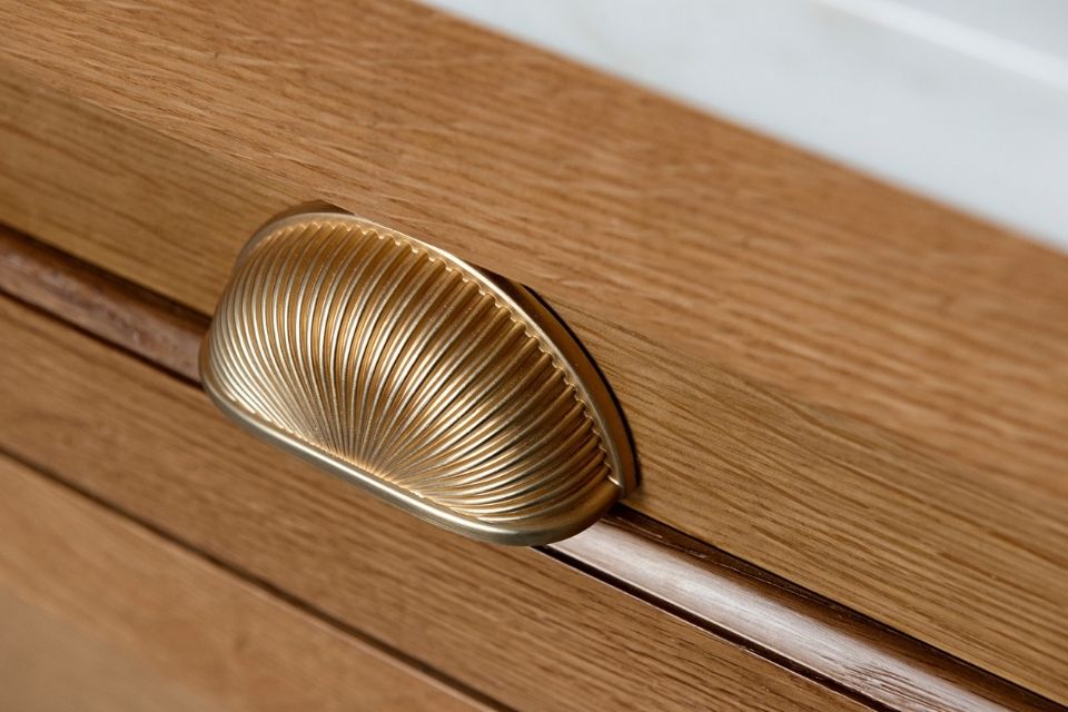 Bronze seashell shaped pull on bathroom vanity